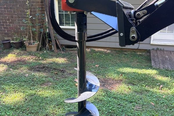 Auger attachment for mini loader — photo 1